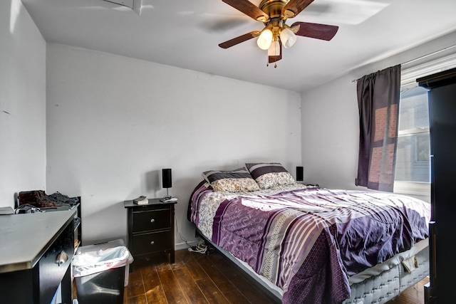 bedroom featuring ceiling fan and dark hardwood / wood-style floors