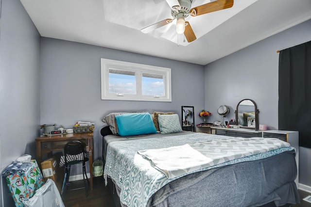 bedroom featuring ceiling fan and dark hardwood / wood-style floors