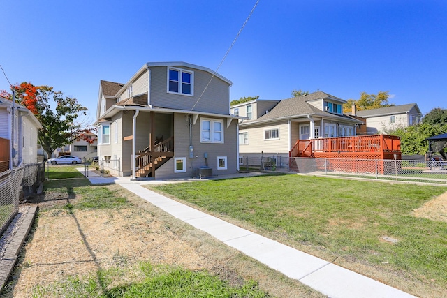 back of house featuring central air condition unit, a yard, and a wooden deck