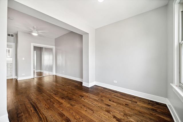 empty room featuring wood-type flooring and ceiling fan