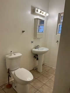 bathroom with tile patterned flooring and toilet