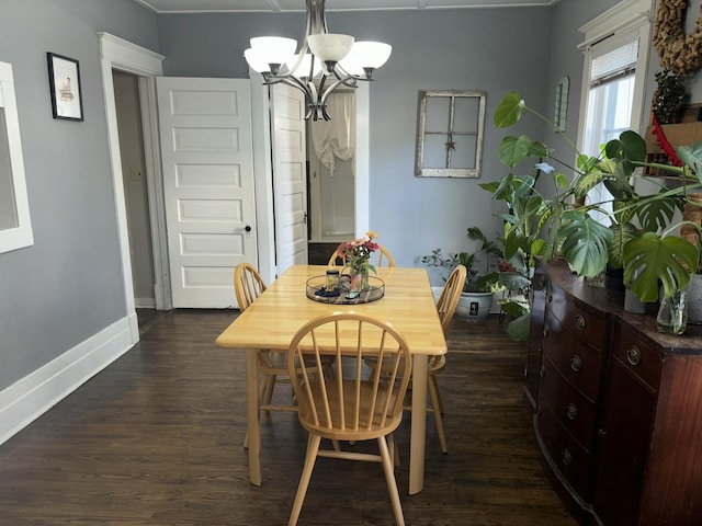 dining area featuring a chandelier and dark hardwood / wood-style floors