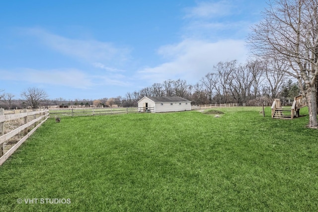 view of yard with a rural view