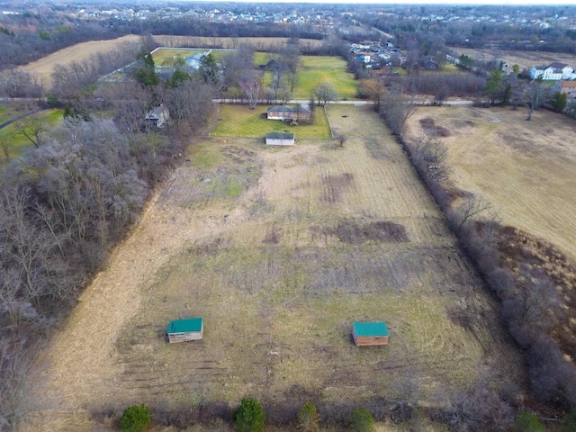 birds eye view of property with a rural view