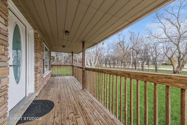 deck featuring a lawn