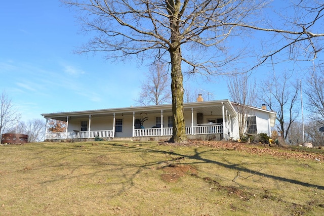 view of front of house featuring a front yard and a porch