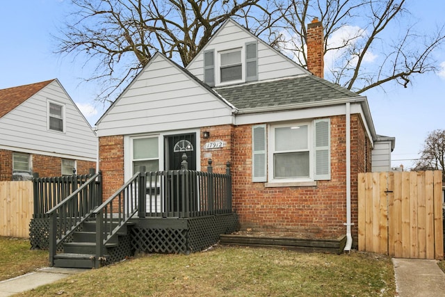 bungalow-style house with a front yard