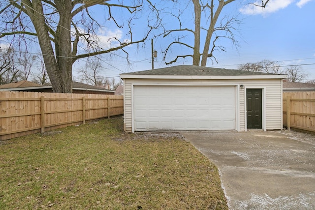 garage featuring a yard