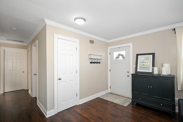 foyer featuring dark hardwood / wood-style flooring and ornamental molding