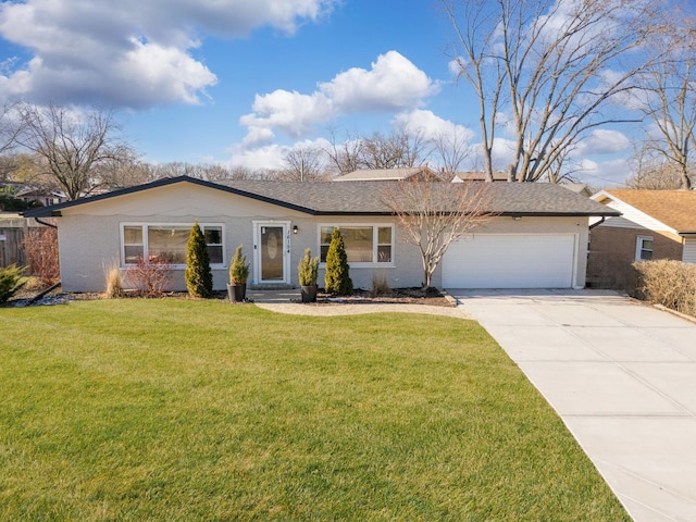 single story home with a garage and a front lawn