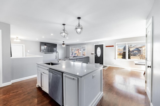 kitchen featuring stainless steel dishwasher, ceiling fan, sink, pendant lighting, and white cabinetry