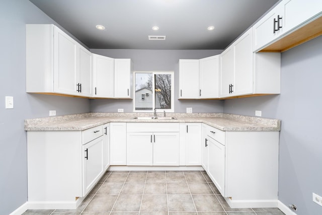 kitchen with white cabinets and sink