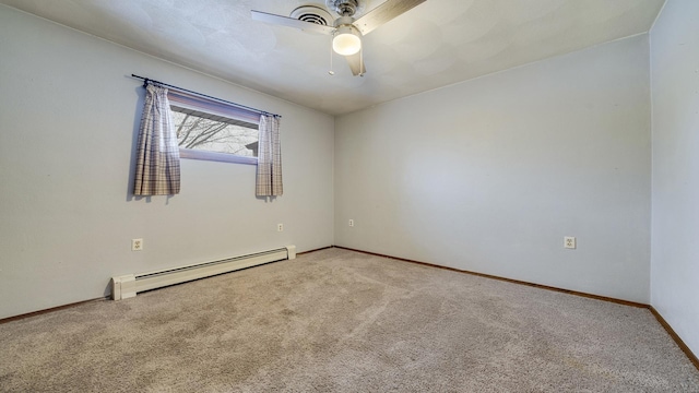 spare room with carpet flooring, ceiling fan, and a baseboard heating unit