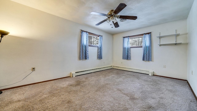 empty room with ceiling fan, carpet floors, and a baseboard radiator