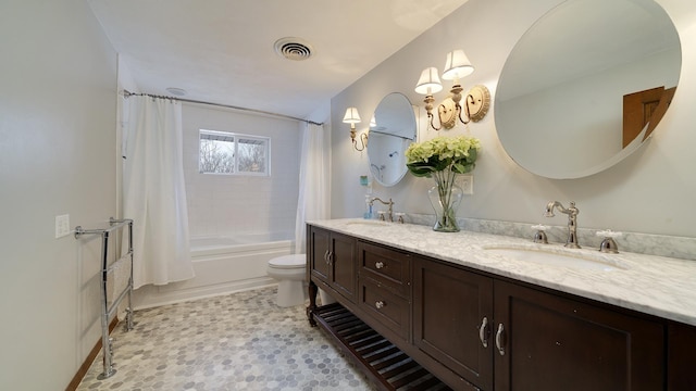 full bathroom featuring toilet, vanity, and shower / tub combo with curtain