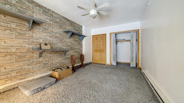 unfurnished living room with ceiling fan and baseboard heating