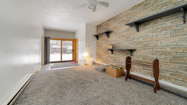 unfurnished living room with baseboard heating and ceiling fan