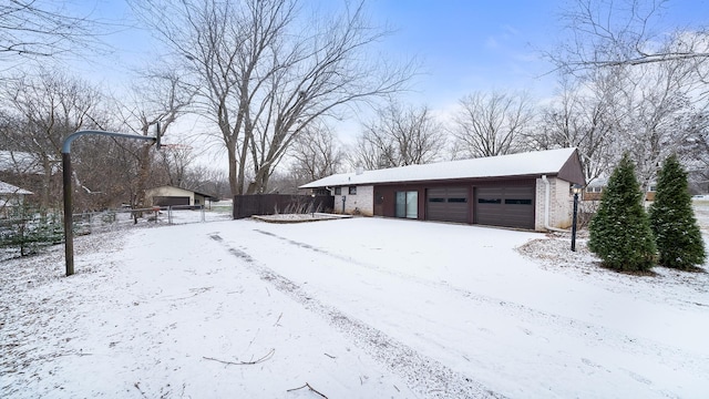 exterior space featuring an outbuilding and a garage