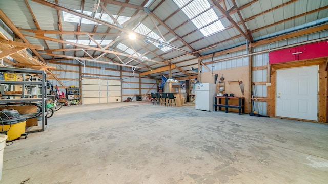 garage featuring white fridge