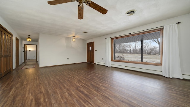 unfurnished living room with ceiling fan, dark hardwood / wood-style flooring, and a baseboard radiator