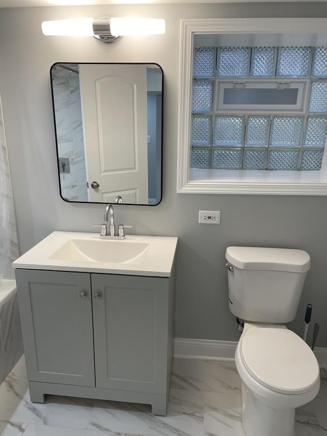 bathroom featuring vanity and toilet