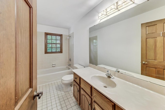 full bathroom featuring tile patterned flooring, vanity, toilet, and tiled shower / bath