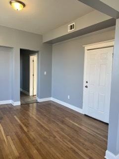 unfurnished room with dark hardwood / wood-style floors