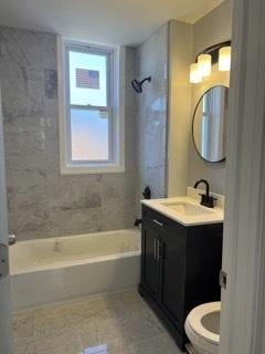 full bathroom with tile patterned flooring, vanity, toilet, and tiled shower / bath