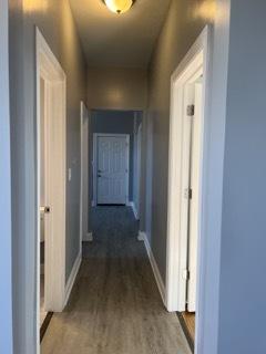 hall featuring dark hardwood / wood-style floors