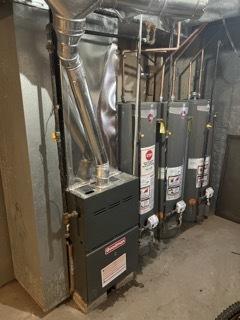 utility room with water heater