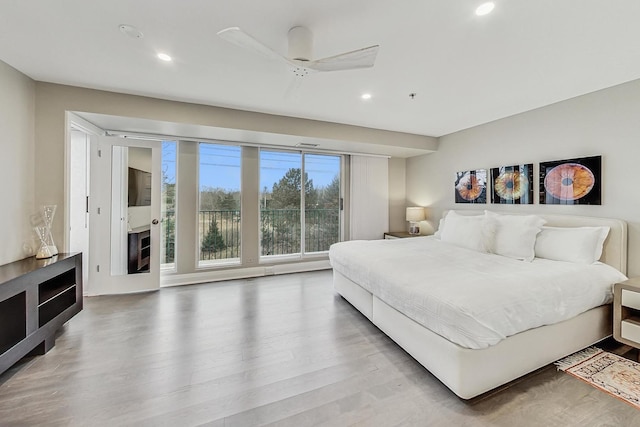 bedroom with wood-type flooring and ceiling fan