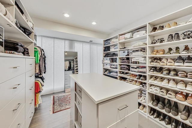 spacious closet with light wood-type flooring