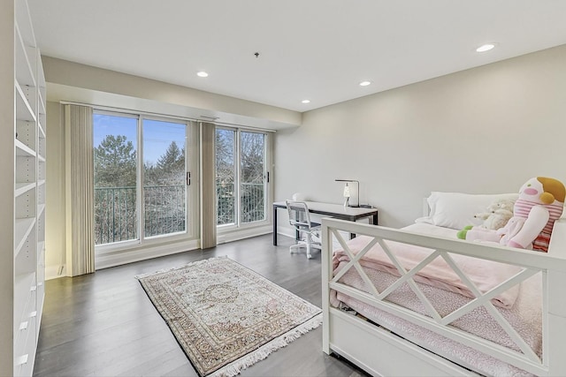 bedroom featuring dark hardwood / wood-style flooring