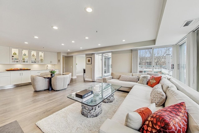 living room with light hardwood / wood-style floors