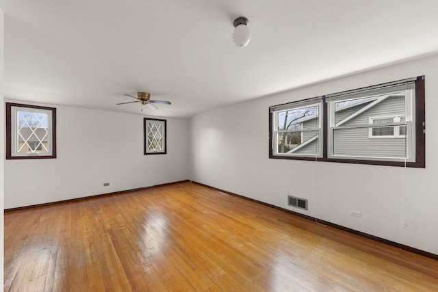 unfurnished room featuring ceiling fan and light wood-type flooring