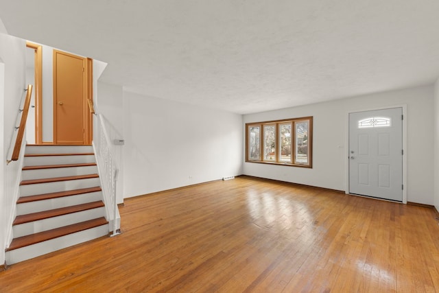 foyer with light hardwood / wood-style flooring