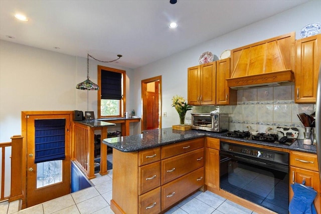 kitchen with light tile patterned floors, premium range hood, black appliances, decorative backsplash, and kitchen peninsula