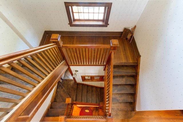 staircase featuring hardwood / wood-style flooring