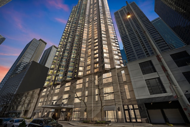 view of outdoor building at dusk