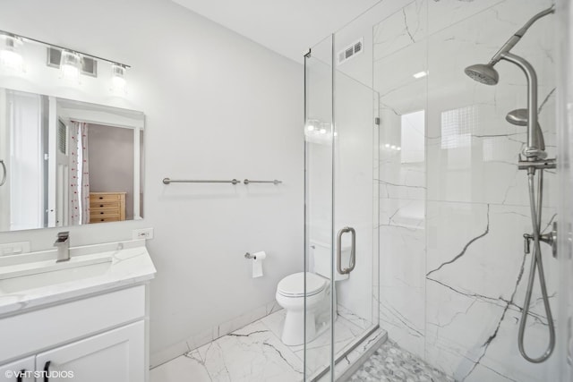 bathroom featuring toilet, vanity, and walk in shower