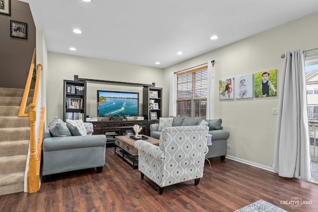 living room with dark hardwood / wood-style flooring