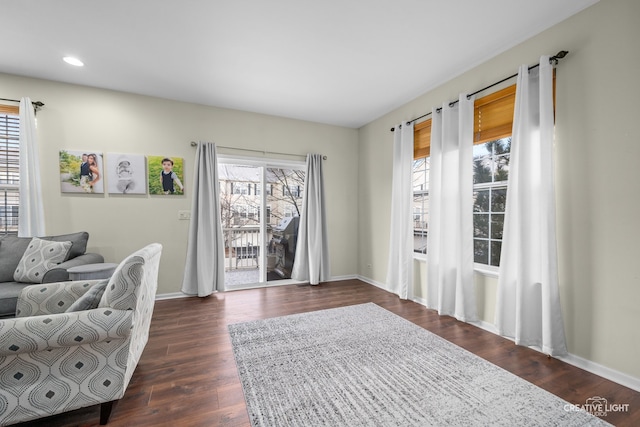 sitting room with dark hardwood / wood-style floors