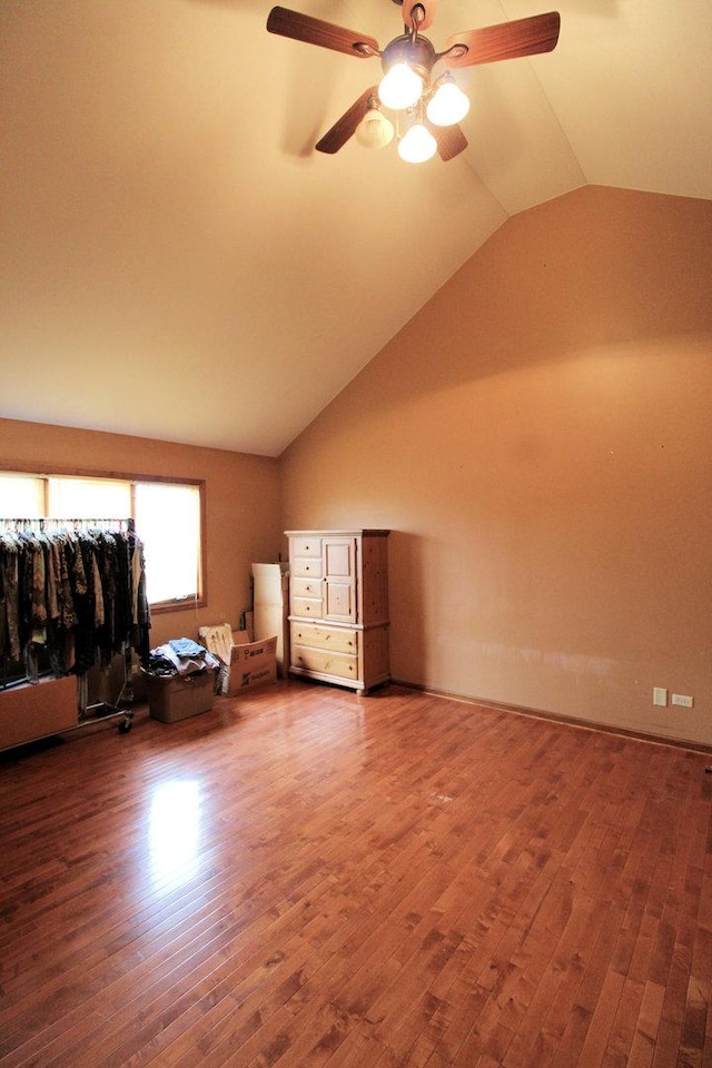 bonus room featuring hardwood / wood-style floors, vaulted ceiling, and ceiling fan