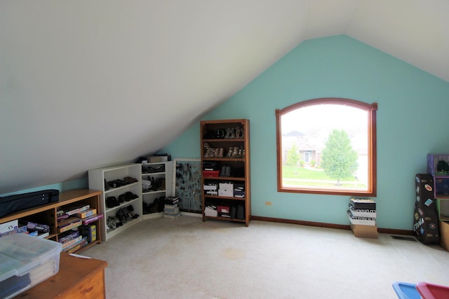 interior space with carpet and lofted ceiling