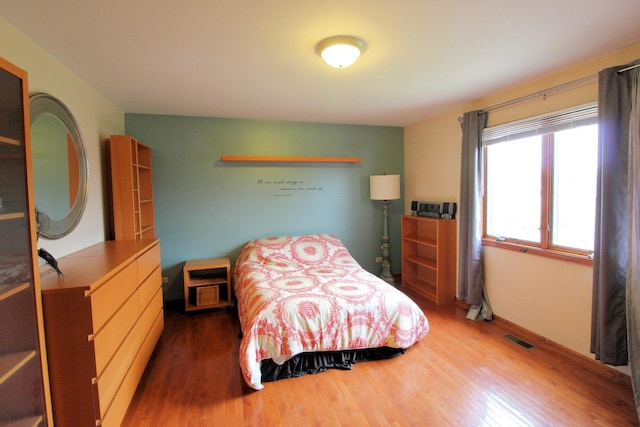 bedroom featuring hardwood / wood-style floors