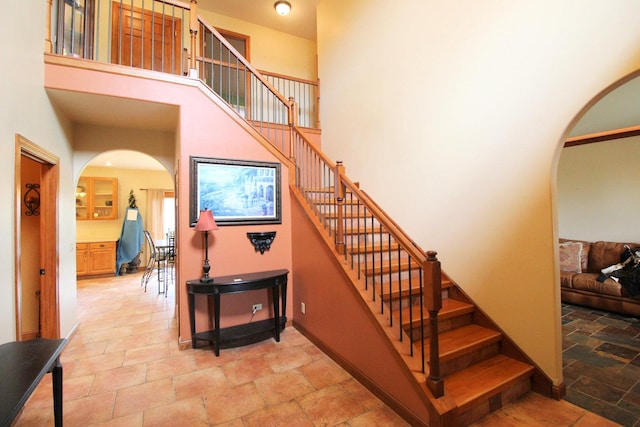 stairway with a towering ceiling