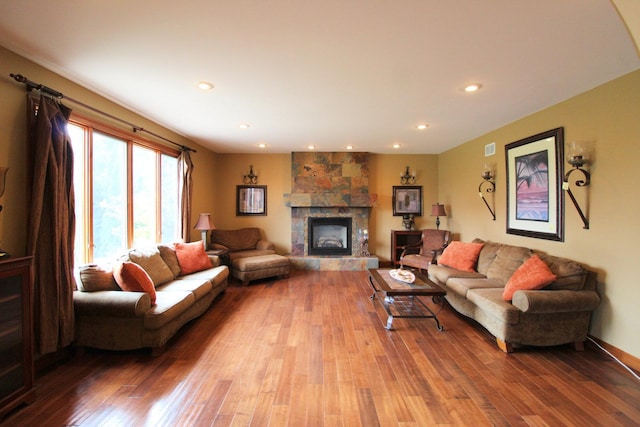 living room with a fireplace and light hardwood / wood-style floors