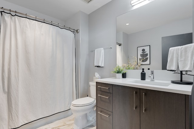 bathroom featuring vanity and toilet