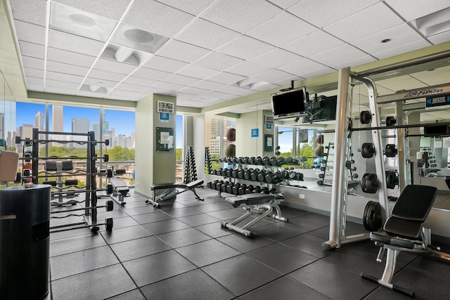 workout area featuring a drop ceiling