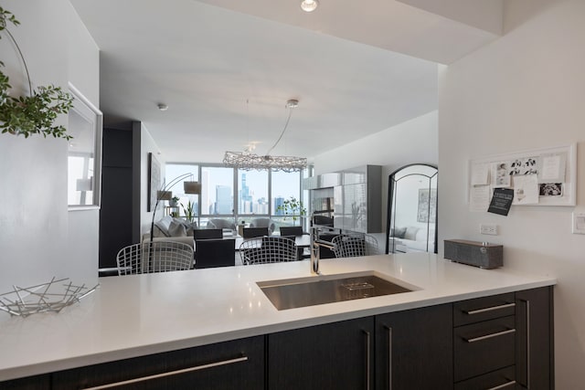 kitchen with an inviting chandelier and sink